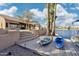 Picturesque waterfront property with a private dock, paddleboard, kayak, and lush landscaping at 1241 W Lobster Trap Dr, Gilbert, AZ 85233