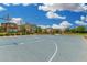 The community basketball court includes homes and landscaping around it at 1250 N Abbey Ln # 206, Chandler, AZ 85226