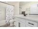 Well-lit bathroom with a combination tub and shower, a modern vanity, and stylish accents at 1250 N Abbey Ln # 206, Chandler, AZ 85226