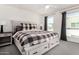 Bright bedroom featuring a spacious bed with storage drawers and a large window for plenty of natural light at 1250 N Abbey Ln # 206, Chandler, AZ 85226