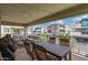 This covered patio includes outdoor seating with a neighborhood view at 1250 N Abbey Ln # 206, Chandler, AZ 85226