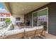 This covered patio includes outdoor seating and a grill for outdoor dining at 1250 N Abbey Ln # 206, Chandler, AZ 85226