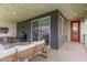 This covered patio features an exterior door, sliding door, and outdoor seating at 1250 N Abbey Ln # 206, Chandler, AZ 85226