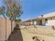 Spacious backyard featuring gravel landscaping, a block fence, and a covered patio at 13431 N 30Th St, Phoenix, AZ 85032