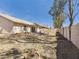 Wide-open backyard with gravel landscaping, block fence, and covered patio at 13431 N 30Th St, Phoenix, AZ 85032