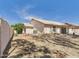 Large backyard space with gravel landscaping, block fence, and covered patio at 13431 N 30Th St, Phoenix, AZ 85032
