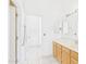 Bright bathroom featuring double sinks, tile flooring, and updated fixtures at 13431 N 30Th St, Phoenix, AZ 85032