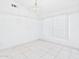 Bright living room featuring tile floors, large window, and chandelier lighting at 13431 N 30Th St, Phoenix, AZ 85032