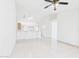 Bright and open floor plan with tile flooring leading to a breakfast bar at 13431 N 30Th St, Phoenix, AZ 85032