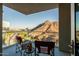 Private balcony with chairs offering expansive views of the city and landmark mountain at 140 E Rio Salado Pkwy # 1006, Tempe, AZ 85281
