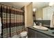 Bathroom with a shower and bathtub, including a sink on top of a dark countertop at 140 E Rio Salado Pkwy # 1006, Tempe, AZ 85281
