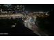 Night view of city streets and buildings, including Carvana building at 140 E Rio Salado Pkwy # 1006, Tempe, AZ 85281