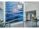 Elegant lobby with a water-themed art wall, modern chandelier, and sleek design at 140 E Rio Salado Pkwy # 1006, Tempe, AZ 85281