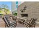 Relaxing outdoor patio with comfortable seating and a stone fireplace feature wall at 140 E Rio Salado Pkwy # 1006, Tempe, AZ 85281