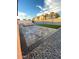 Modern backyard featuring stone pavers, low maintenance landscaping, and privacy wall at 1408 E Orange St, Tempe, AZ 85281