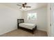 Bright bedroom featuring a ceiling fan, window, and a comfy bed frame at 1408 E Orange St, Tempe, AZ 85281