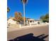 Charming single-story home featuring a secure, fenced front yard with low maintenance landscaping at 1408 E Orange St, Tempe, AZ 85281