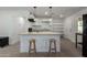 Bright kitchen featuring modern white cabinets, a peninsula, and stainless steel appliances at 1408 E Orange St, Tempe, AZ 85281