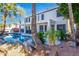Resort style pool in backyard surrounded by lush greenery and palm trees at 1442 W Laurel Ave, Gilbert, AZ 85233