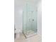 Modern bathroom features a glass enclosed shower with decorative stone floor and updated fixtures at 1442 W Laurel Ave, Gilbert, AZ 85233