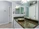 The bathroom features a vessel sink, green marble countertops, and white cabinets at 1442 W Laurel Ave, Gilbert, AZ 85233