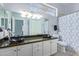 Updated bathroom featuring a double vanity, vessel sinks, and a shower/tub combo at 1442 W Laurel Ave, Gilbert, AZ 85233