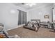 Cozy bedroom with plush carpeting, a window with curtains, and a queen-size bed with a floral comforter at 1442 W Laurel Ave, Gilbert, AZ 85233