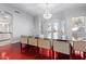 Chic dining room featuring modern chandelier and sleek glass table perfect for entertaining at 1442 W Laurel Ave, Gilbert, AZ 85233