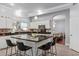 Open concept kitchen features a large island, stainless steel appliances, and granite countertops at 1442 W Laurel Ave, Gilbert, AZ 85233