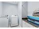 Convenient laundry room with counter space, storage cabinets, and modern washer and dryer at 1442 W Laurel Ave, Gilbert, AZ 85233