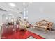 Spacious living room with high ceilings, grand staircase, and elegant seating arrangement at 1442 W Laurel Ave, Gilbert, AZ 85233