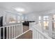 Bright living area with updated flooring, a bay window and chandelier in a modern design at 1442 W Laurel Ave, Gilbert, AZ 85233