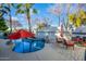 Inviting backyard with a sparkling pool, comfortable seating, and shade umbrellas at 1442 W Laurel Ave, Gilbert, AZ 85233