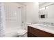 Bathroom featuring modern vanity with white countertop, dark wood cabinets, a bath and shower, and stylish fixtures at 15805 W Morning Glory St, Goodyear, AZ 85338