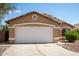 Charming single-story home featuring a two-car garage and desert landscaping under a clear blue sky at 15805 W Morning Glory St, Goodyear, AZ 85338