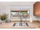 Well-lit kitchen sink and counter with a double bowl sink, modern faucet and view of the backyard through a window at 15805 W Morning Glory St, Goodyear, AZ 85338
