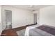 Spacious main bedroom featuring hard wood floors, a ceiling fan, with access to a full ensuite bathroom at 15805 W Morning Glory St, Goodyear, AZ 85338