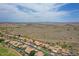 Picturesque aerial view of a residential area boasting well-maintained houses and beautiful desert scenery at 16219 S 14Th Way, Phoenix, AZ 85048
