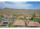 Aerial view of a home nestled in a desert community with mountain views at 16219 S 14Th Way, Phoenix, AZ 85048