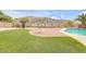 Artificial turf in backyard plus desert landscaping and a view of the swimming pool at 16219 S 14Th Way, Phoenix, AZ 85048