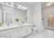 Bathroom with dual sinks, and a door to the backyard at 16219 S 14Th Way, Phoenix, AZ 85048