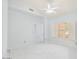 Inviting bedroom with vaulted ceilings, a ceiling fan, and bright windows at 16219 S 14Th Way, Phoenix, AZ 85048