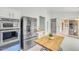 Updated kitchen with stainless steel appliances and access to a breakfast nook and living area at 16219 S 14Th Way, Phoenix, AZ 85048