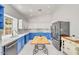 Spacious kitchen features two-tone cabinetry, marble countertops, and stainless steel appliances at 16219 S 14Th Way, Phoenix, AZ 85048