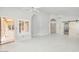 Open living area featuring white tile floors, lots of natural light and access to multiple rooms at 16219 S 14Th Way, Phoenix, AZ 85048