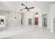 An open concept living area featuring a ceiling fan, chandelier and large entry ways at 16219 S 14Th Way, Phoenix, AZ 85048