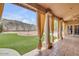 Covered patio featuring tiled flooring, decorative columns, and a view of the backyard at 16219 S 14Th Way, Phoenix, AZ 85048