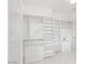 Spacious walk-in closet with custom white shelving and drawers at 16219 S 14Th Way, Phoenix, AZ 85048