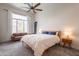 Inviting bedroom featuring a comfortable bed, a cozy sofa, and ample natural light, perfect for relaxation at 1635 E Harrison St, Chandler, AZ 85225
