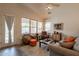 Living room featuring a neutral color palette, wood flooring, comfortable seating and plenty of natural light at 1635 E Harrison St, Chandler, AZ 85225